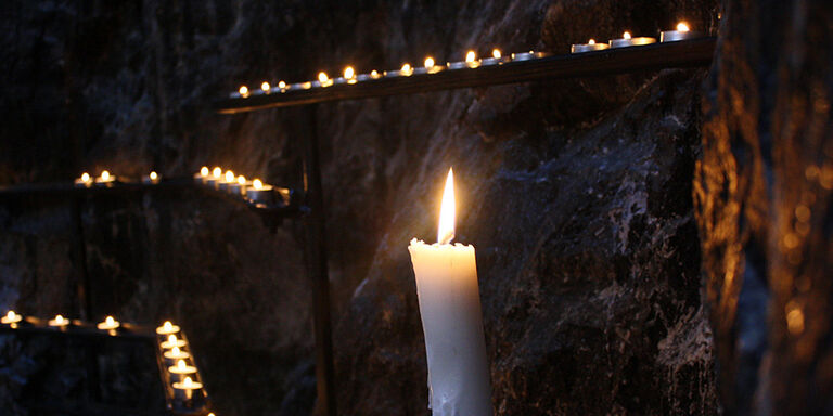 Candles along the rock walls